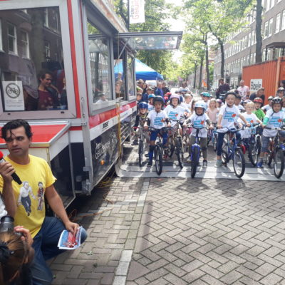 Kids enjoying a bicycle race in Amsterdam