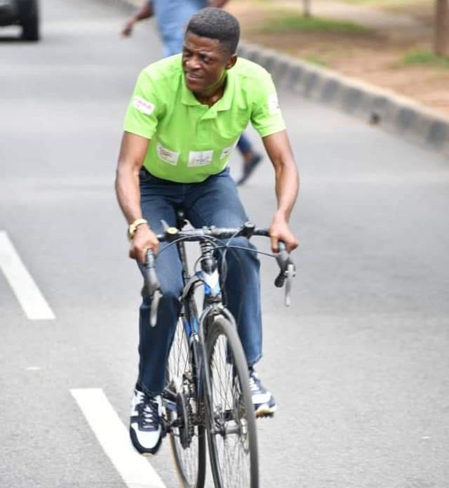 Emmanuel John riding his bike